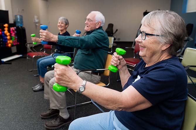 Patients using weights during physical therapy